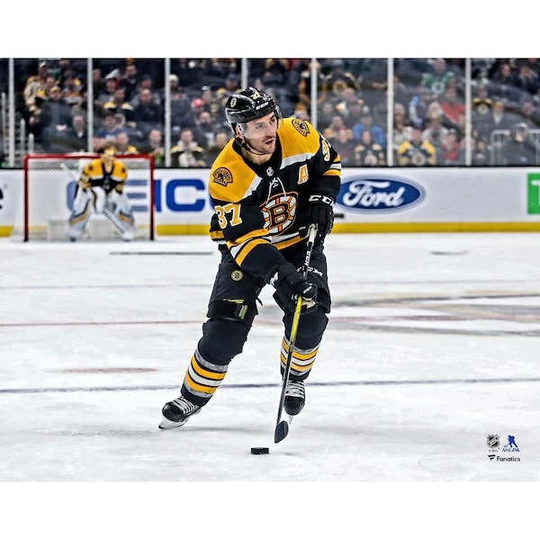 Patrice Bergeron Boston Bruins Unsigned Black Jersey Skating Photograph